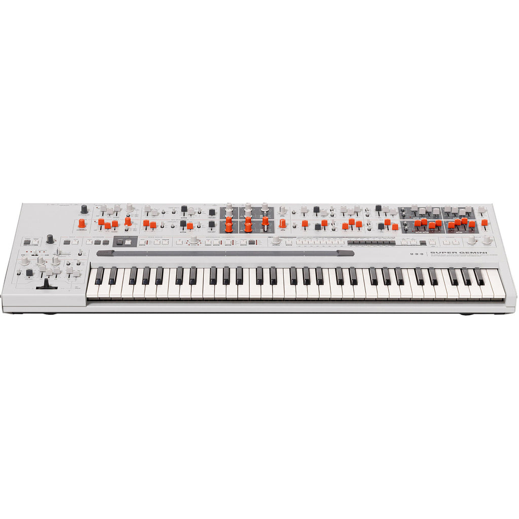 UDO Audio Super Gemini synthesizer with vintage-style knobs, colorful interface, and multiple control panels on a black background.