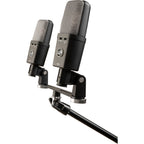 Warm Audio WA-14SP condenser microphone shown with its sleek metal body and grille, ideal for professional recording and vocals.