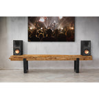 Black Klipsch R-50PM wireless speakers with sleek design and compact size, showcasing their front speaker grille and control panel.