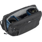 Think Tank PressPass sling bag for video equipment, compact design with multiple compartments for DSLR cameras and accessories.
