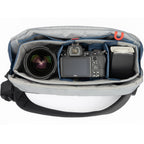 Think Tank PressPass Sling Bag for video equipment with padded compartments and adjustable strap for easy carrying.