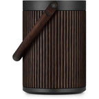 Bang & Olufsen Beosound A5 portable speaker with sleek design, fabric covering, and control buttons on top.