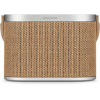 Bang & Olufsen Beosound A5 portable speaker with sleek design, fabric grille, and control buttons on top.