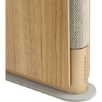 Bang & Olufsen Beosound Emerge wireless speaker in gold tone with sleek design and compact size.
