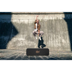 Klipsch Detroit portable speakers with sleek design and rich sound quality on a wooden surface.