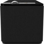 Klipsch The One Plus wireless speaker showing its compact design with a fabric grille and control buttons on top.