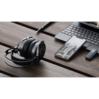 FiiO FT5 wired headphones with black earphones and inline remote, resting on a white background.