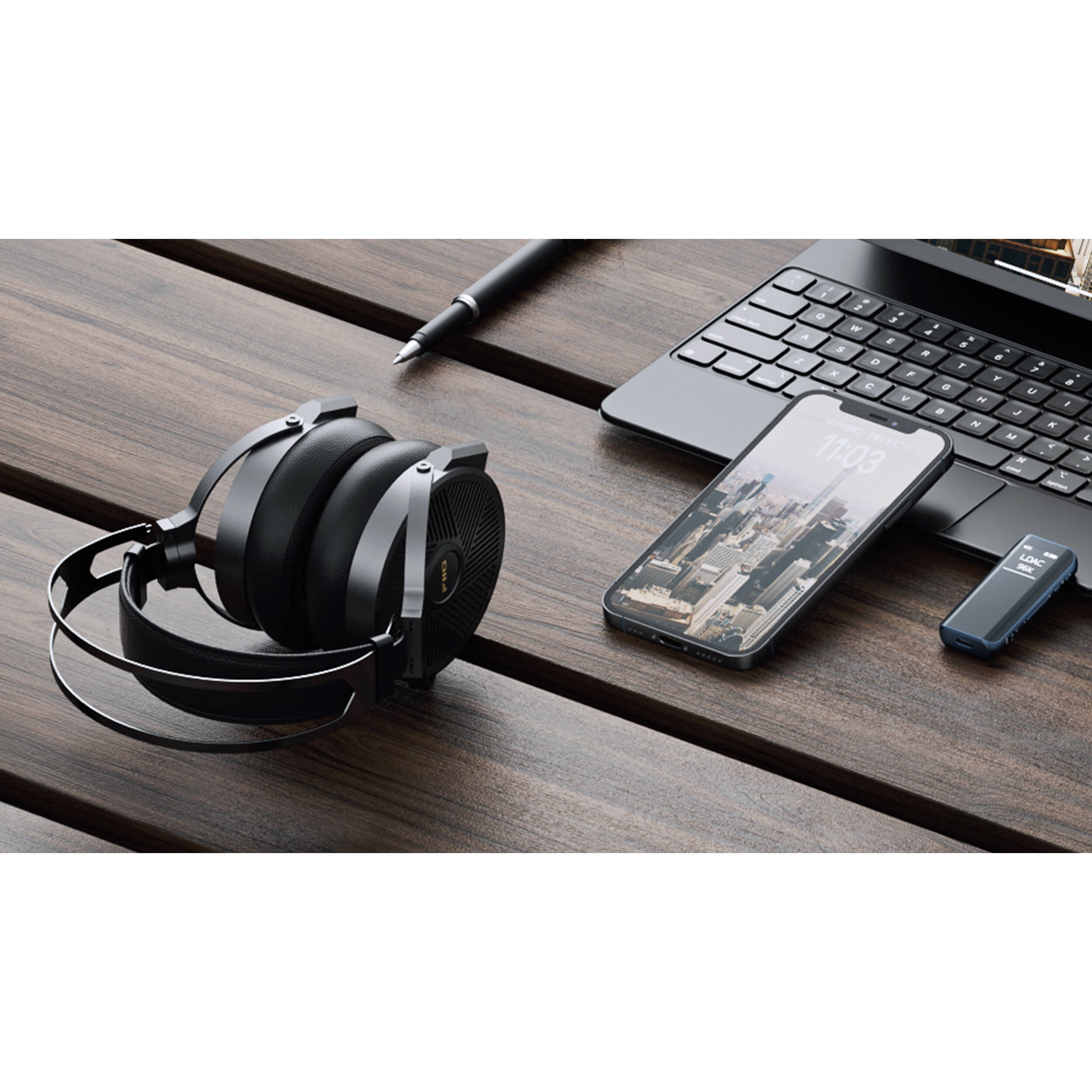 FiiO FT5 wired headphones with black earphones and inline remote, resting on a white background.