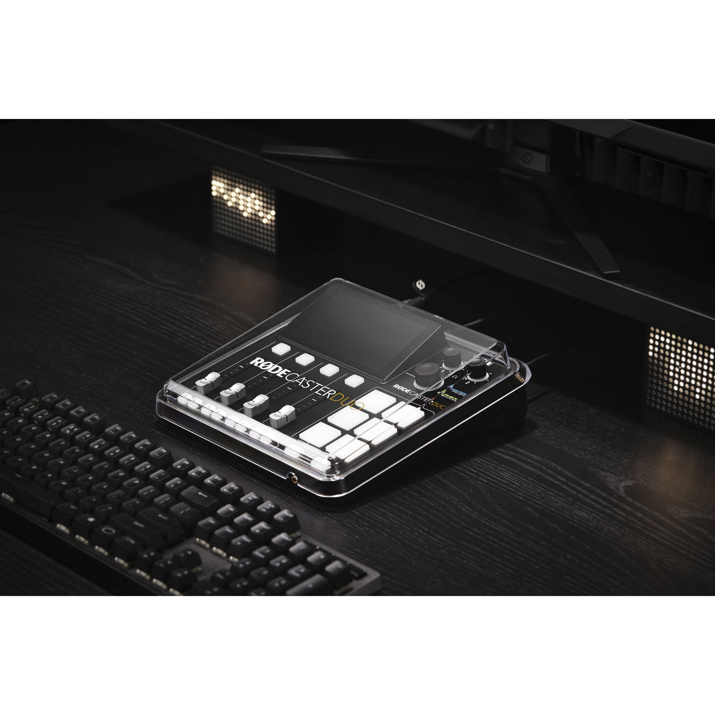 Rode Rodecaster Duo Cover, protective accessory for Rode audio mixer, shown on device with black material and logo.