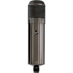 Warm Audio WA-47T condenser microphone with silver finish and vintage-style grille, mounted on a stand against a neutral background.