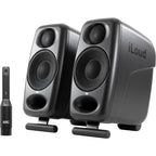 IK Multimedia iLoud Micro Monitor Pro active nearfield monitors showing dual speakers and control interface in a studio setup.