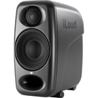 IK Multimedia iLoud Micro Monitor Pro active nearfield studio monitors on a desk with audio equipment.