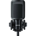 Shure SM4 condenser microphone kit with microphone, stand, and accessories for professional audio recording.