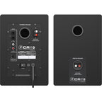 Mackie CR5BT desktop speakers with black finish, featuring control knobs and audio input ports, designed for home or office use.