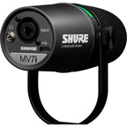 Shure MV7i USB microphone with black finish and built-in controls, positioned on a desk for podcasting or streaming setup.