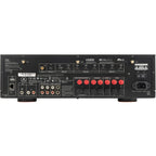 JBL MA7100HP stereo amplifier with multiple audio input ports and control knobs, black metal casing, and display panel.