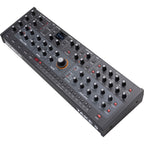 Sequential Take 5 desktop synthesizer with control knobs and keyboard keys, compact electronic music instrument.