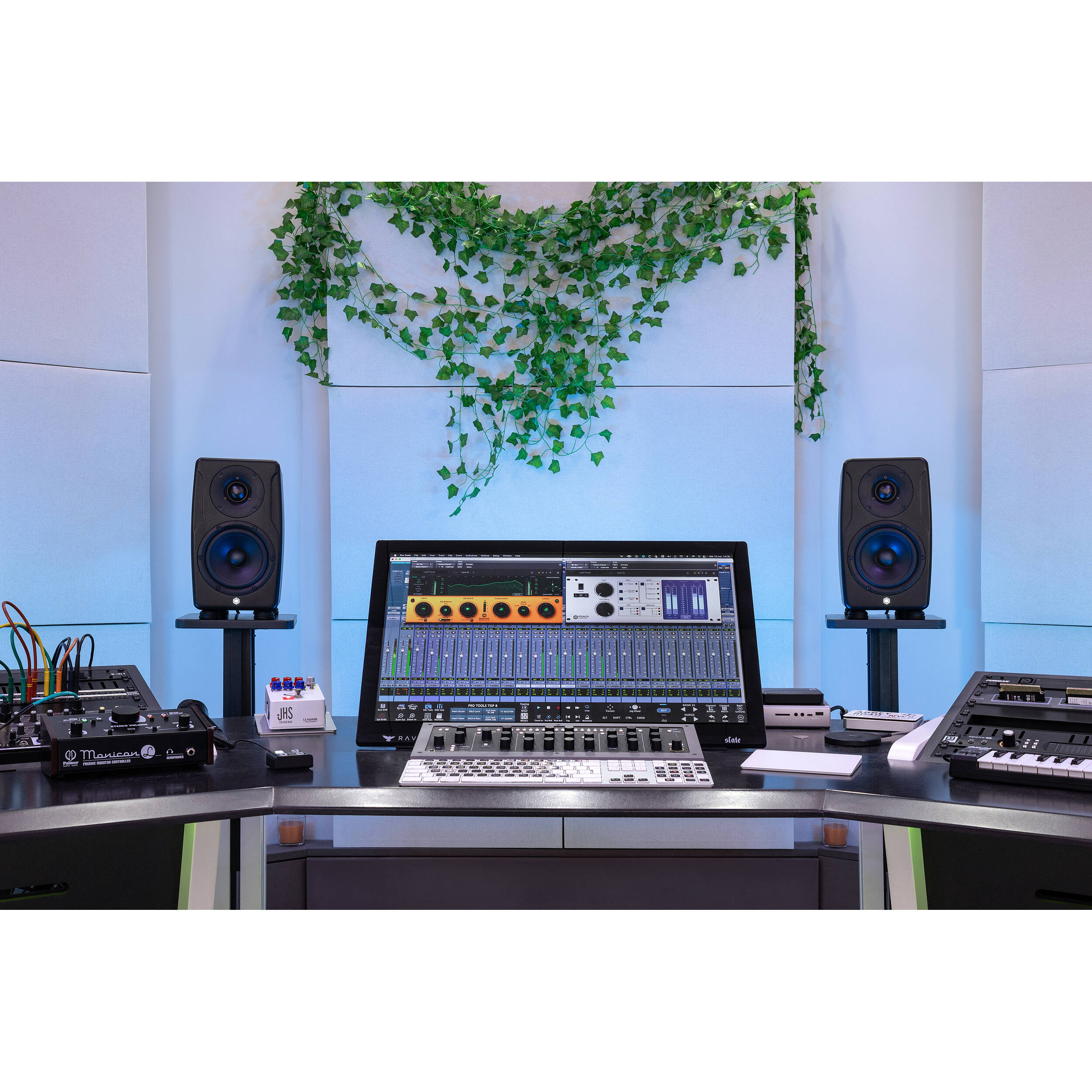 IK Multimedia iLoud Precision 5 MK2 active nearfield monitors showing front view with control knobs and speaker grille.
