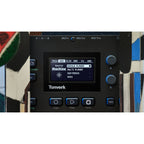 Elektron Tonverk drum machine and sampler with knobs, buttons, and display for music production.