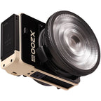 Zhiyun Molus LED X200 RGB COB light combo displaying adjustable RGB colors and brightness settings on a professional lighting panel.
