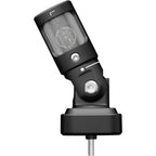 Shure MV88 iOS and Android microphone connected to a smartphone, compact and portable audio recording device.