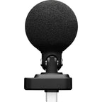 Shure MV88 iOS and Android microphone connected to a smartphone, showcasing portable audio recording equipment.