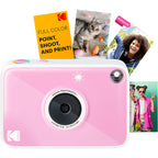 Kodak Printomatic+ instant compact camera with black body, ready to print photos, on a white background.