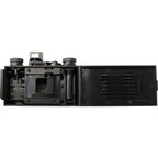 Ilford Pixie 35-II compact instant camera with a sleek black design and lens, ready for instant photography.