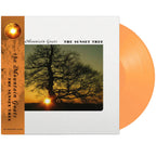 Limited edition apricot vinyl LP of The Mountain Goats' The Sunset Tree, featuring colorful album artwork and 4AD branding.