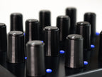 Close-up of Intech Studio PO16 Series 3 MIDI controller with knobs, buttons, and a sleek black design for music production.