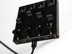 Close-up of Intech Studio PBF4 Series 3 MIDI controller with linear mechanical faders and control knobs.