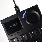 Close-up of Intech Studio VSN1 Series 3 MIDI controller with knobs and buttons, showing detailed controls and sleek design.