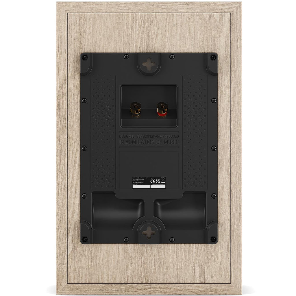 DALI Sonik On-Wall in-wall and outdoor speakers mounted on a wall, showcasing sleek design and grille details.
