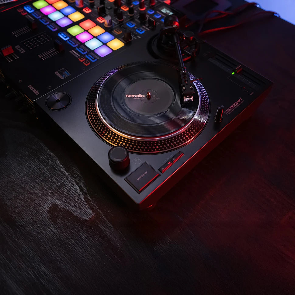 Black Reloop RP-7 DJ turntable with professional tonearm and control features, designed for high-quality DJ mixing.