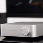 WiiM AMP music streamer device with sleek black design and multiple connectivity ports, perfect for high-quality audio streaming.
