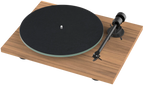 Pro-Ject T1 EVO turntable with sleek wooden plinth and tonearm, showcasing its modern design and high-quality audio components.