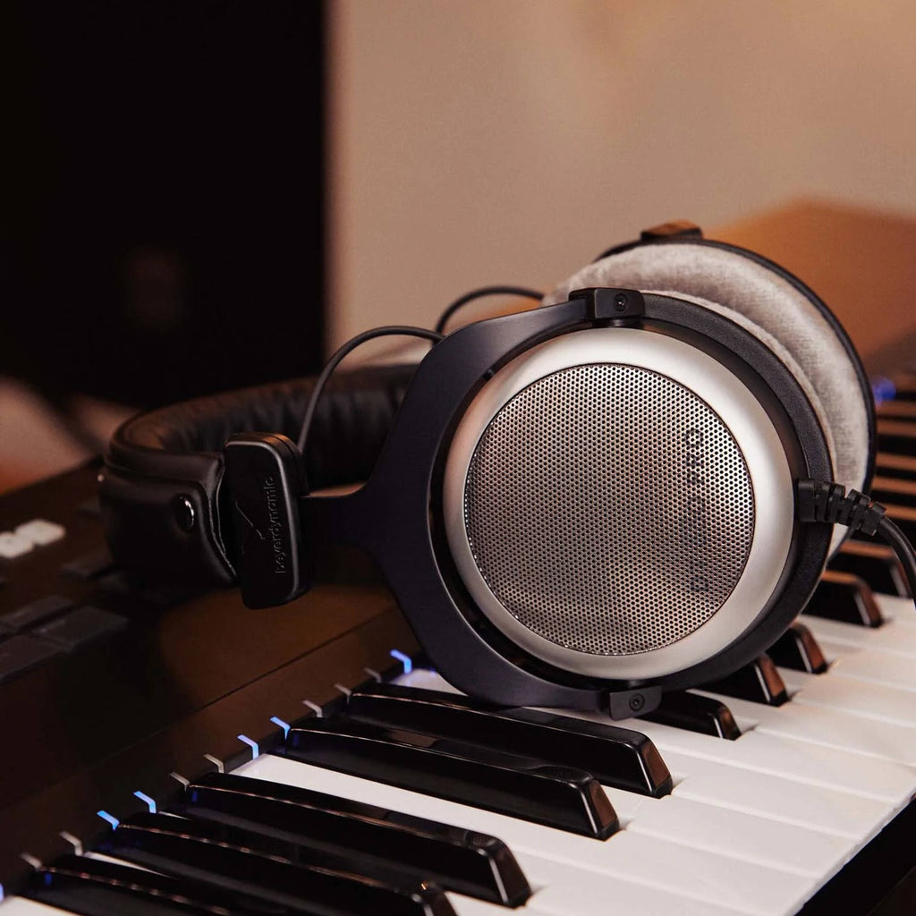 Beyerdynamic DT 880 Pro studio headphones with 250 ohm impedance, featuring over-ear design and professional audio quality.