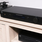 NAD C 338 stereo amplifier with sleek black finish and control knobs, designed for high-quality home audio listening.