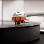 Sumiko Oriole MC phono cartridge mounted on turntable tonearm, showcasing detailed stylus and body design.