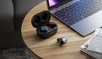FiiO FW5 wireless in-ear headphones with sleek black earbuds and inline controls, designed for high-quality audio and comfort.
