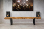 Black Klipsch R-40PM wireless speakers with sleek design, shown in a close-up image highlighting the speaker grille and branding.