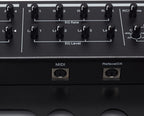 Dtronics DT-RDX-V2 synthesizer featuring a compact keyboard, control knobs, and colorful LED display for music production.