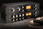 Warm Audio WA76-D signal processor with vintage-style knobs and meters, mounted in a professional audio setup.