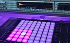 Akai Professional APC64 MIDI controller with Ableton drum pack software interface and 64 pads for music production.