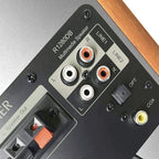 Edifier R1280DBS desktop speakers with wood finish and control knobs on the front, designed for high-quality audio.