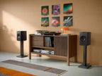 KEF Q1 Meta passive bookshelf speakers with sleek black finish and front grille, designed for high-quality home audio.