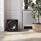 DALI Dali Sub E-9 F subwoofer with black cabinet, front view showing speaker grille and control panel