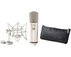 Warm Audio WA-87jr condenser microphone with nickel finish, shown in a group shot highlighting its compact design.