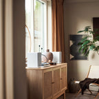 Argon Audio Forte A5 WiFi active bookshelf speakers with white finish, featuring sleek design and speaker grille, connected to audio equipment.