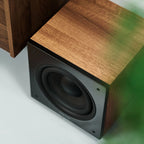 Argon Audio Malmö Sub 8 subwoofer with black finish, compact design, and speaker grille, designed for deep bass sound.
